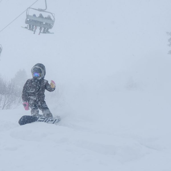 Young Snowboarder In deep snow