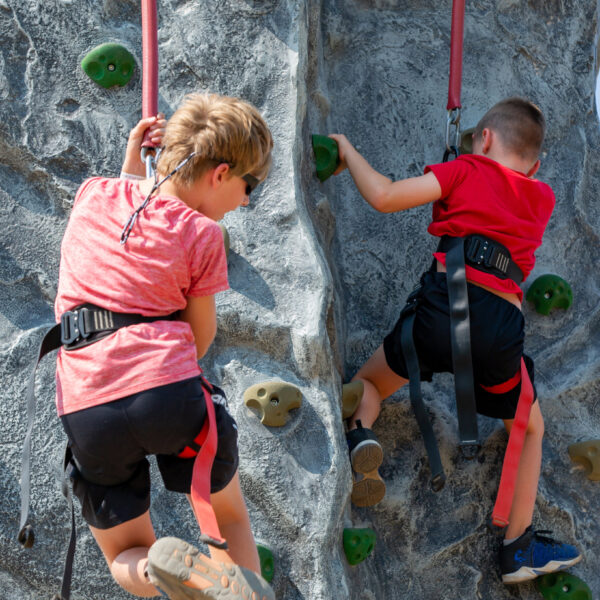 Two Young Children Wearing Red Climbing The Stack Rock Climbing Wall At Bogus Basin 07-2021 4x5 Photo By Luke Tokunaga 1639x 2048