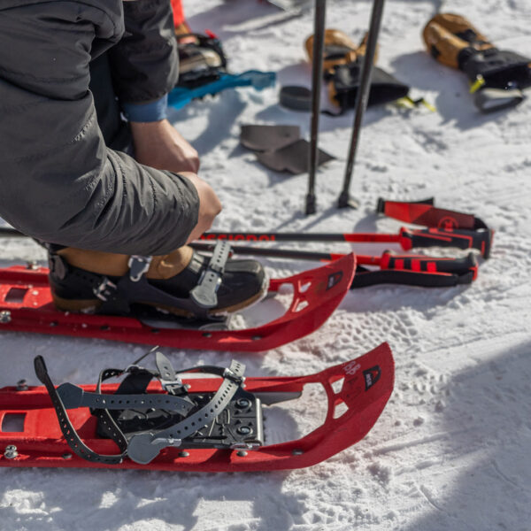 Guest Putting On Red Snowshoes Touring Bogus Basin Mountain Recreation Area Frontier Point Nordic Trail System Winter December 2023 Photo By Cassidy Carter 1920px1080px