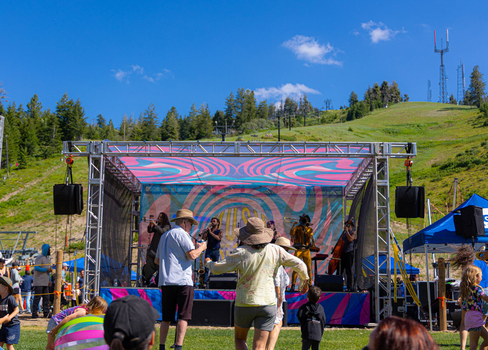 High Step Society Playing On Stage With Deer Point Towers In The Background Summer 2025 At Bogus Basin 07 2025 Photo By Bridgette Johnson 2048x 1468