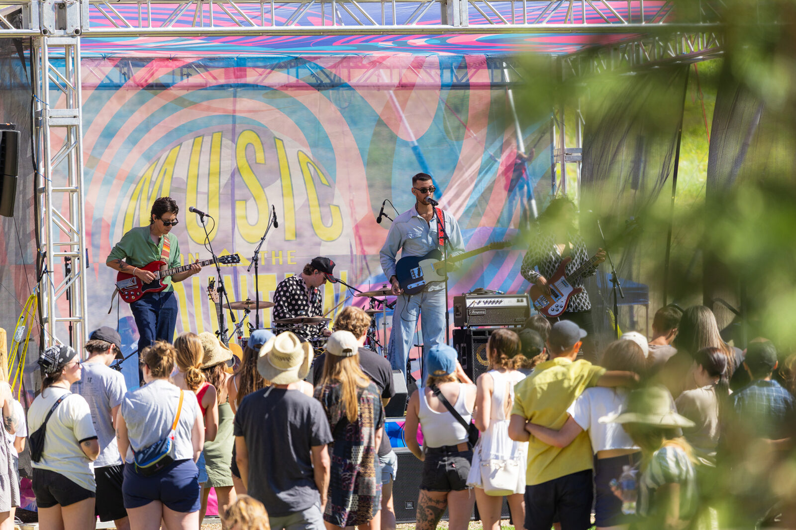 Baby Jake And Band Performing For Crowd Of Dancing People With Greenery In Foreground Summer 2025 At Bogus Basin 07 2025 Photo By Cassidy Carter 2084x 1390