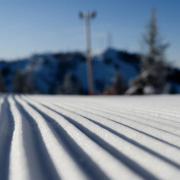Groomed Run Close Up Corduroy With Light Pole And Towers In Background Blurry Winter At Bogus Basin Mountain Recreation Area 1920px1080px