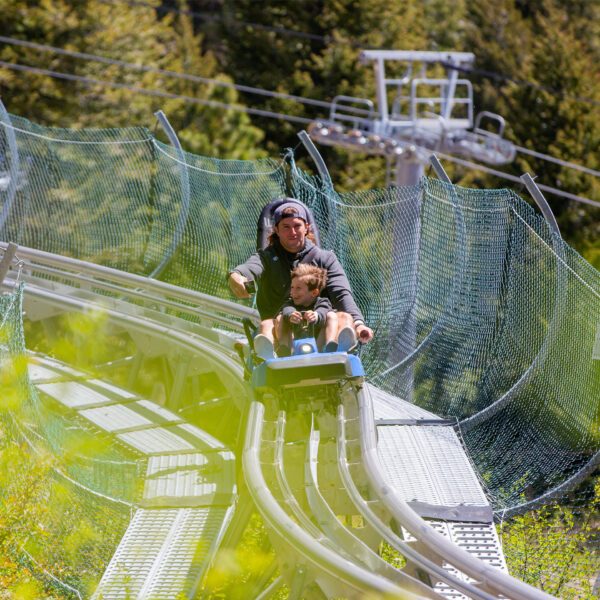 Father And Son Riding The Glade Runner Mountain Coaster Smiling Summer At Bogus Basin Mountain Recreation Area 1920px1920px