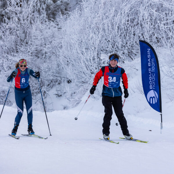Card Two Nordic Skiers Smiling Crossing Finish Line Of Community Race Series Skiathalon At Bogus Basin December 2023 Photo By Cassidy Carter 1920px 1920px