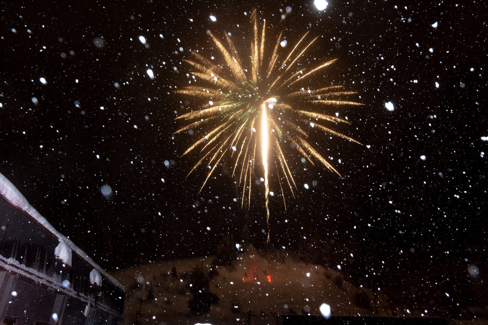 Orange Fireworks with Falling Snow New Years Day Torchlight Parade And Fireworks Celebration